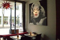 The interior of "The Icon," located at 206 State Street, is aptly decorated, with spotlighted artwork on the walls.
