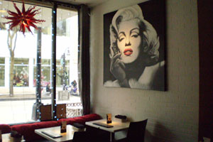 The interior of The Icon, located at 206 State Street, is aptly decorated, with spotlighted artwork on the walls.