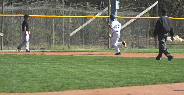 Treysen Vavra celebrates on his way into third base after hitting a home run during the Madison College baseball team's home opener on Friday, April 6
