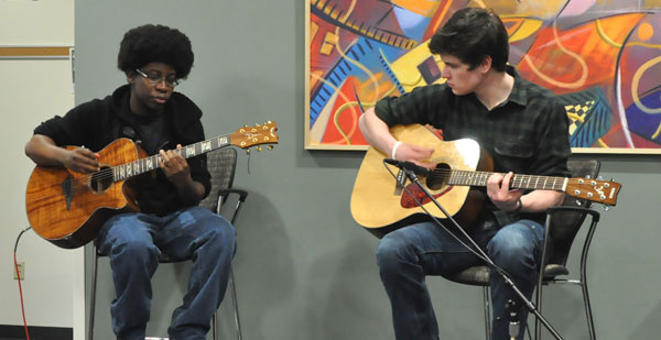 Two student musicians perform in the WolfPack Den as part of the Dens effort to add more entertainment.