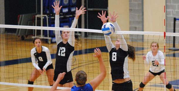 Madison College’s Chrissy Marti (12) and Kensey Loger (8) go up for a block.