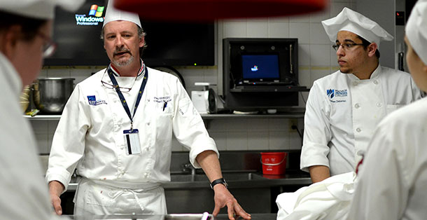 Madison College Culinary Program Director Mike Stark speaks to students in Truaxs gourmet kitchen on April 2, 2013.