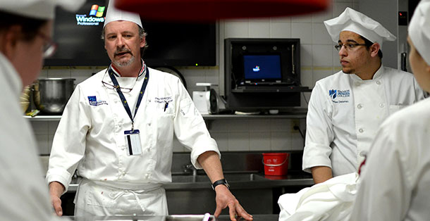 Madison+College+Culinary+Program+Director+Mike+Stark+speaks+to+students+in+Truaxs+gourmet+kitchen+on+April+2%2C+2013.