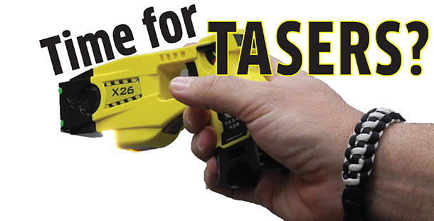 Public Safety Director Jim Bottoni holds the type of taser he would like officers to carry.