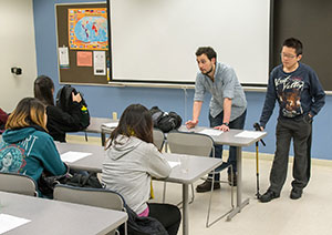 At a recent World Students Association meeting, Rafael Guenoun, treasurer of the club, and Justin Chan, vice president, speak with fellow members of the club.