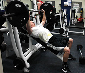 Madison College student JJ Lowell works out in the Truax campus fitness center.