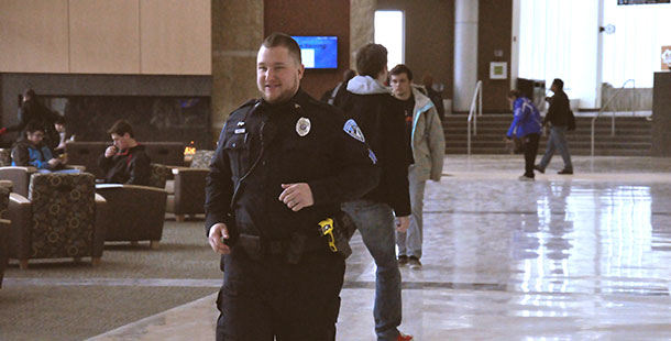 Public Safety officer Joseph Steffan on his rounds of the Truax campus wearing a taser on his left hip.