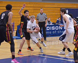 Madison College’s Tanner Schieve (34) drives past a Triton College defender as teammate Griffin Eckhart (44) looks on.