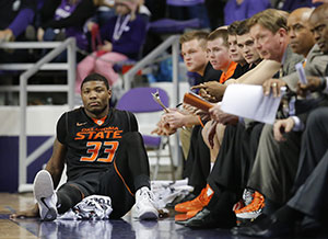 Oklahoma State’s Marcus Smart sits on the bench with four fouls during the second half against Kansas State at Bramlage Coliseum in Manhattan, Kan., on Saturday, Jan. 4. K-State won, 74-71.