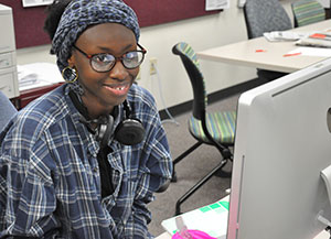 Fanta Sylla, copy editor of The Clarion, takes a short break from work for a photo.