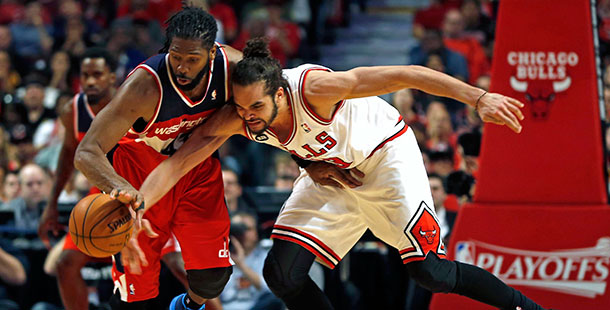 The Washington Wizards Nene, left, steals the ball from Chicago Bulls Joakim Noah in the fourth quarter of Game 1 of the NBA Eastern Conference quarterfinals at the United Center in Chicago, Sunday, April 20.