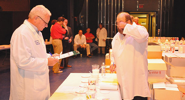 Judges sample items at the World Dairy Expo Championship on Aug. 20 in the Mitby Theater.