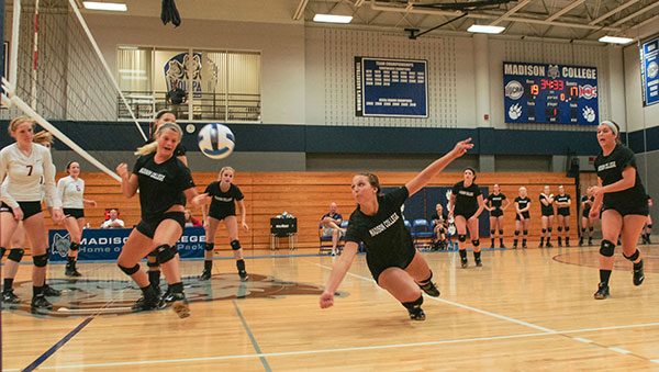 The Madison College volleyball team participates in a pre-season scrimmage.