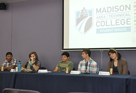 Issac Brown, right, leads a Student Senate Candidate Forum at the Truax Campus.