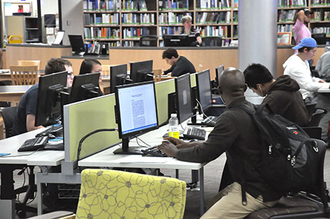 Students work on research for their class projects in the Truax campus library.