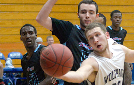 Madison College sophomore Shane Kanaman (32) grabs a loose ball against UW-Rock County on Nov. 12.