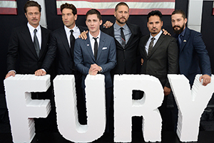 From left, Brad Pitt, Jon Bernthal, Logan Lerman, director David Ayer, Michael Pena, and Shia LaBeouf attend the premiere of “Fury” at the Newseum in Washington, D.C.