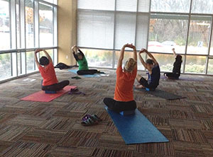 Students enjoy a yoga session being offered at the Madison College Health Education Buildling.