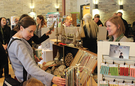 Shoppers examine items for sale at “The Crafty Fair” held on Nov. 17 in Madison’s Goodman Center.