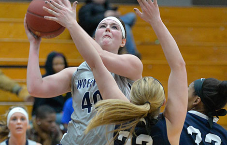 Madison College’s Taylor Nelson, right, drives past a Mid Michigan Community College defender on Feb. 26.