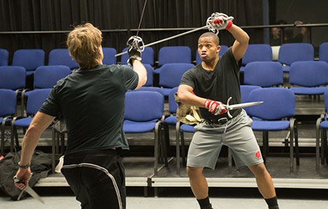 Reggie Kellum (right) practices sword fighting with Jeff Skubal (left) for the upcoming performance of Romeo and Juliet.