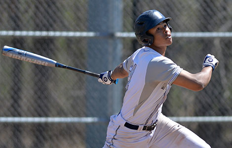 Madison College baseball player Matt Cole looks up after connecting with a pitch during a recent home game.