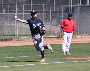 Madison Colleges Brandon Gibis makes a throw from third base during one of the teams games during the spring break trip.