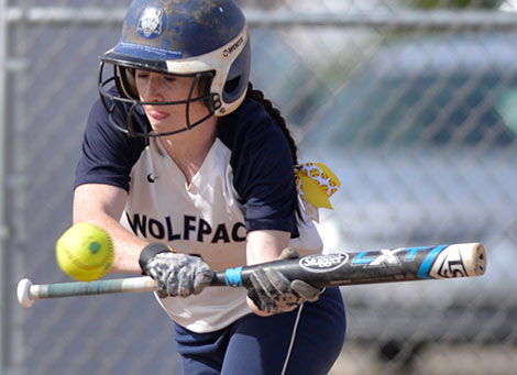 Madison College outfielder Sadie Holmes bunts the ball during a recent home game. The WolfPack softball team has won 7 of its last 10 games and has assured itself a winning record for the season with a 29-15 overall record.