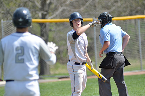 Baseball player Brandon Gibis, shown flipping a bat to a teammate during a May 2 game, was one of two student athletes recognized as the Madison College Sportspeople of the Year at the annual athletic banquet on April 23.
