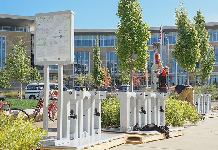 Martha Laugen Madison B-Cyle City Manager installs the new B-Cycle Station.