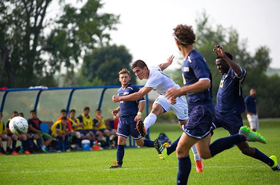 Alfredo Ramirez-Pinho (center) kicks the ball downfield during the September 4th win against Rock Valley College.