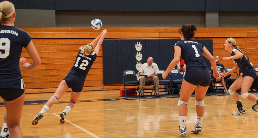 Miranda Durbin (12) dives for the ball during the Sept. 3 volleyball match against Milwaukee Tech.