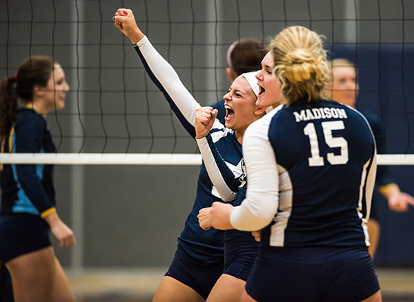 Madison College volleyball players celebrate another point against Rock Valley College on Sept. 22.