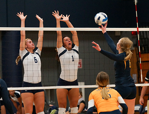Madison College’s Taylor Genthe (6) and Andrea Bauer (1) go up for a block against Lakeland College JV on Oct. 8