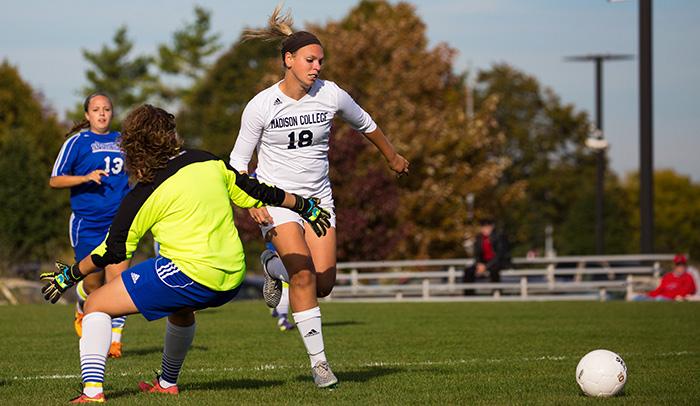 Madison College’s leading scorer Tynia Goldensoph (18) drives past an opponent during a recent match.