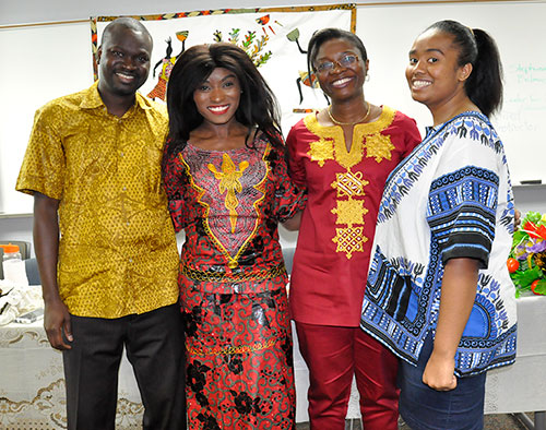 Above, Cherif Correa, Iracema Farmer, Afia Yamoah, and Annucia Martins, (left to right), strike a fashionable pose in clothes from Senegal, Angola, Ghana, and Somalia during the African Awareness Panel.