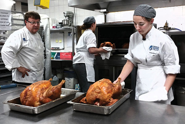 A Culinary Program student helps prepare a Thanksgiving meal.