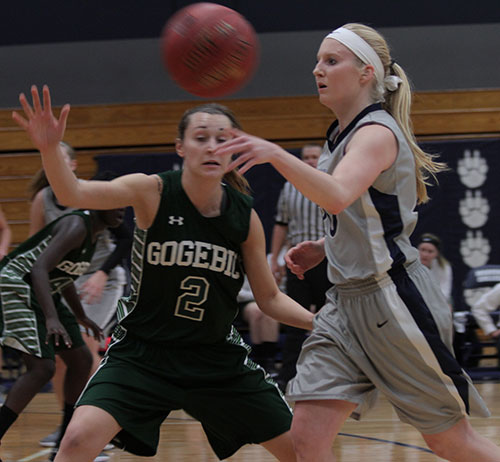 Madison College’s Taylor Nelson, right, passes around a Gogebic opponent during a game at home on Saturday, Nov. 2. The WolfPack women’s basketball team posted a 68-50 victory, improving its record to 3-0.