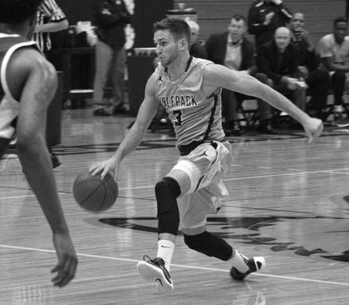 Chase Ramos (3) brings the ball upcourt for Madison College during its game against Elgin Community College on Dec. 5.