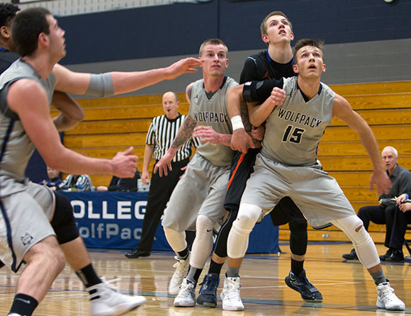 Madison College’s Kristian Zimmerman (15) boxes out a Milwaukee Area Technical College player as he looks for a rebound.