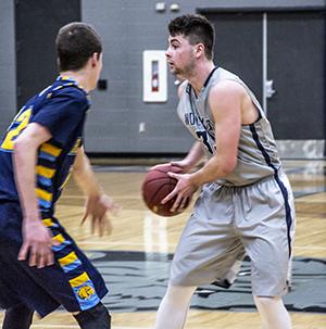 Madison College mens basketball player Ethan Lurquin sets up a defender during a recent game.