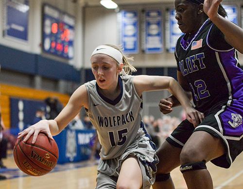 Kaitlyn Kast (15) dribbles past a Joliet Junior College defender during her team’s home victory on Feb. 17. Madison College beat both Joliet and Rock Valley College to win the NJCAA Division II Regional IV title.