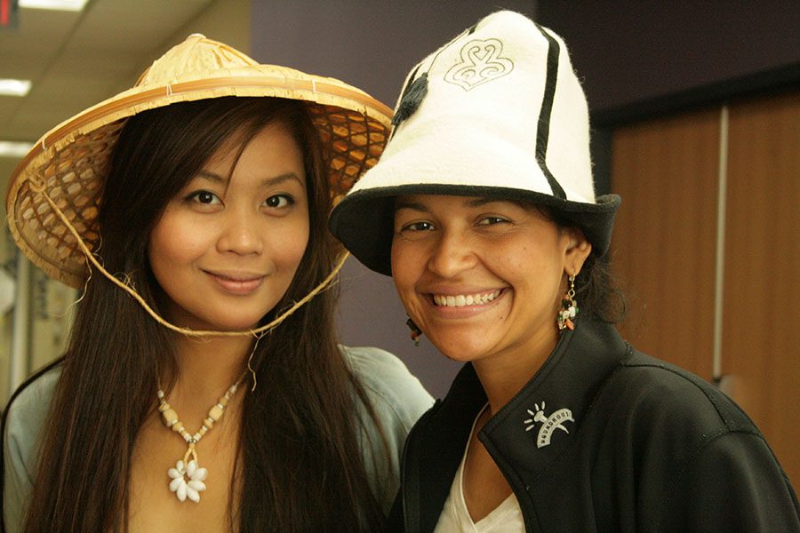 Students show the international hats they wore at the 2014 Global Showcase event held at the Truax Campus.