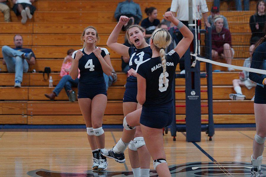 Madison+College+volleyball+players+Keifer+Zimmerman+%284%29%2C+Natasha+Swiggum+%2813%29+and+Taylor+Genthe+%286%29+celebrate+a+point+against+Rock+Valley+College+on+Sept.+29.