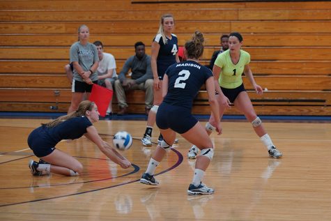 Megan Cochran, left, digs a ball during the Madison College volleyball team’s victory over Rock Valley College on Sept. 29. Teammates Keifer Zimmerman (4), Andrea Bauer (2) and Kaitlin Mooney (1) watch the play.