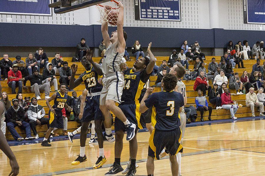 Madison College’s Shane Walden slams home a dunk during his team’s Nov. 22 home game against No. 2 ranked Rochester Community & Technical College. The WolfPack lost a close 84-75 contest.