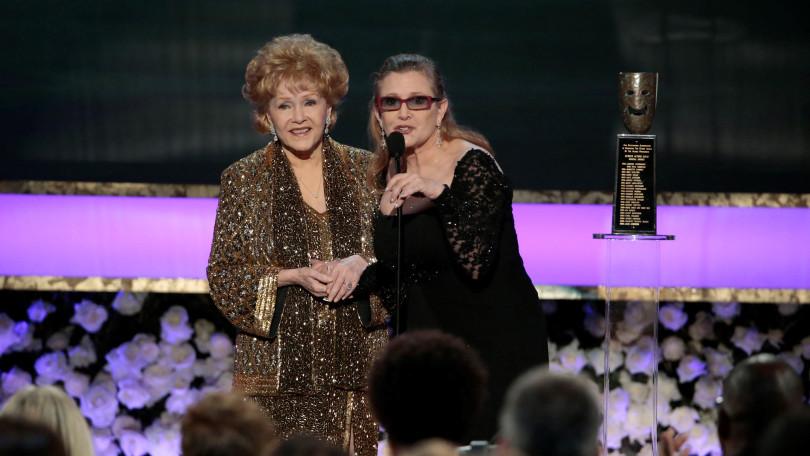 Carrie Fisher presents the Life Achievement Award to Debbie Reynolds at the 21st Annual Screen Actors Guild Awards on Sunday, Jan. 25, 2015, at the Shrine Auditorium in Los Angeles. (Robert Gauthier/Los Angeles Times/TNS)