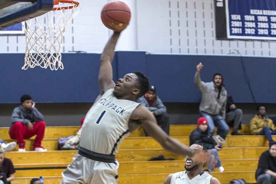 Tyree Young (1) goes in for a dunk during the Madison College men’s basketball team’s game against Milwaukee. The WolfPack is at 9-8 overall and 2-1 in conference play.