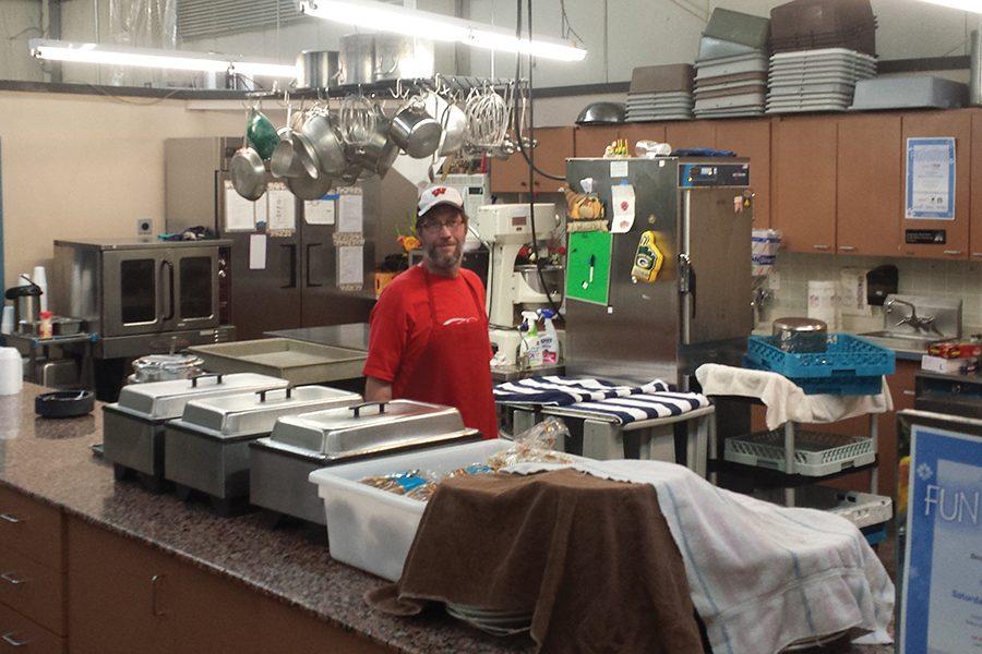 A volunteer waits to serve guests at the River Food Pantry, 2201 Darwin Road. The college's shuttle service will now make two stops a week at the pantry.