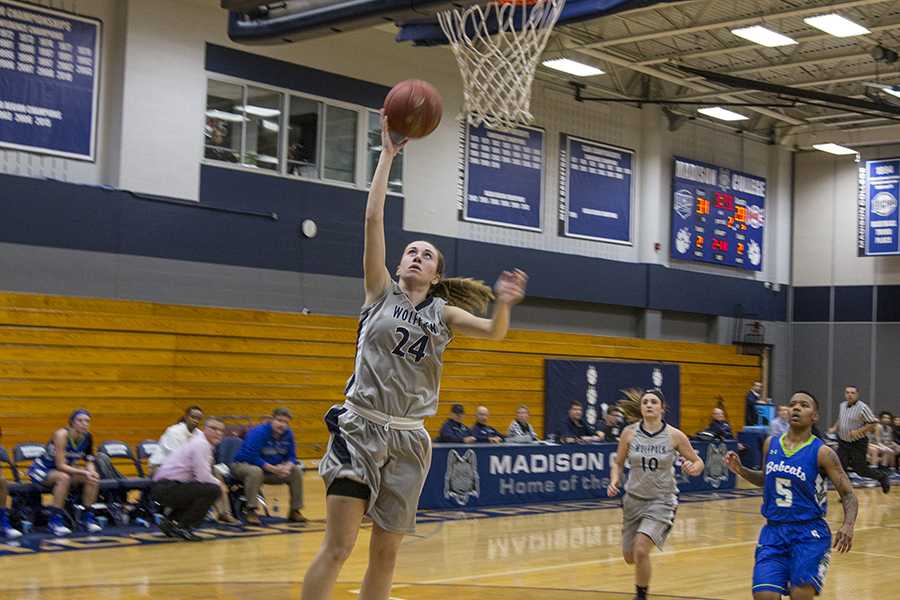 Madison College’s Megan Corcoran scores a layup in a recent game as Macy Graf (10) looks on. The WolfPack have raced to a 13-3 start this season.